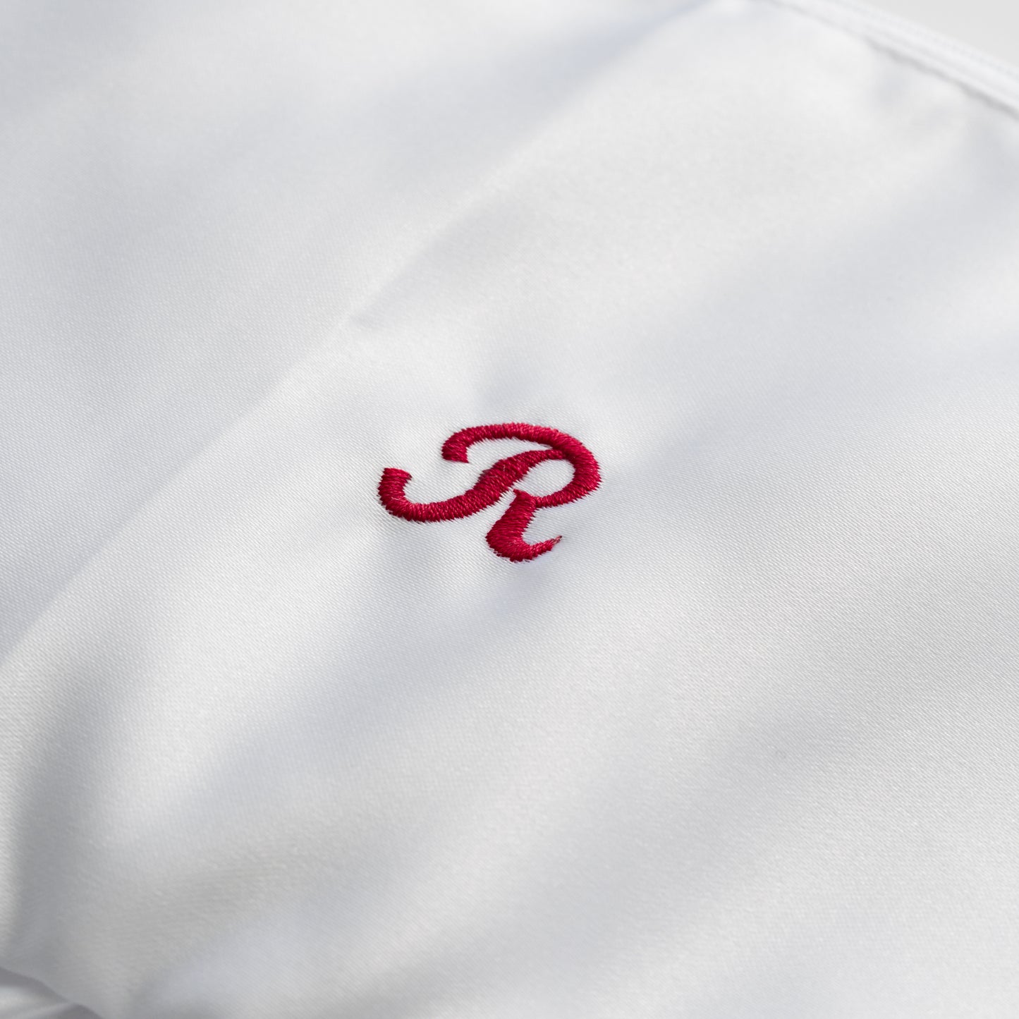 EMBROIDERED INITIAL WHITE SATIN RUFFLE MINI CLUTCH BAG