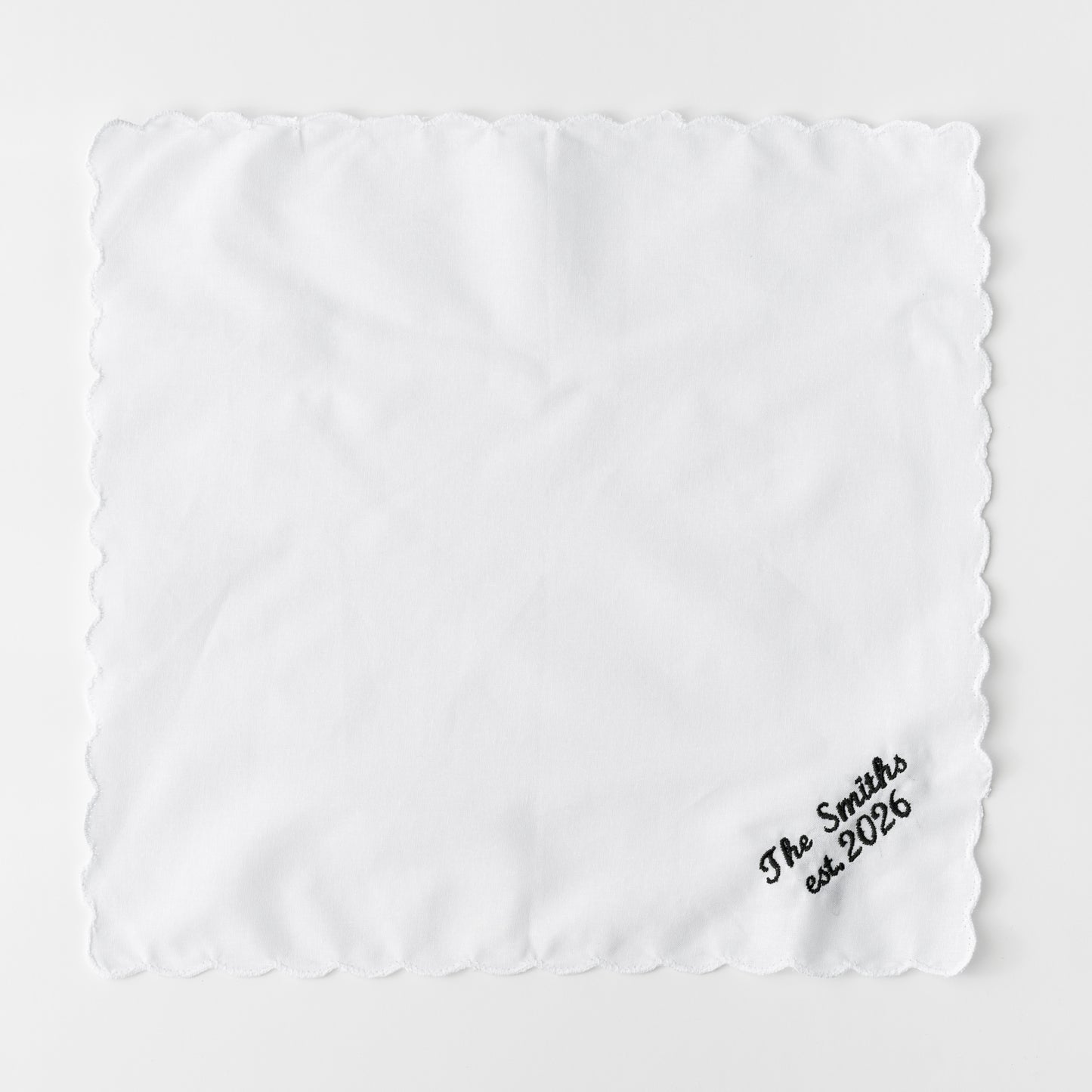 EMBROIDERED SURNAME WHITE SCALLOP NAPKIN