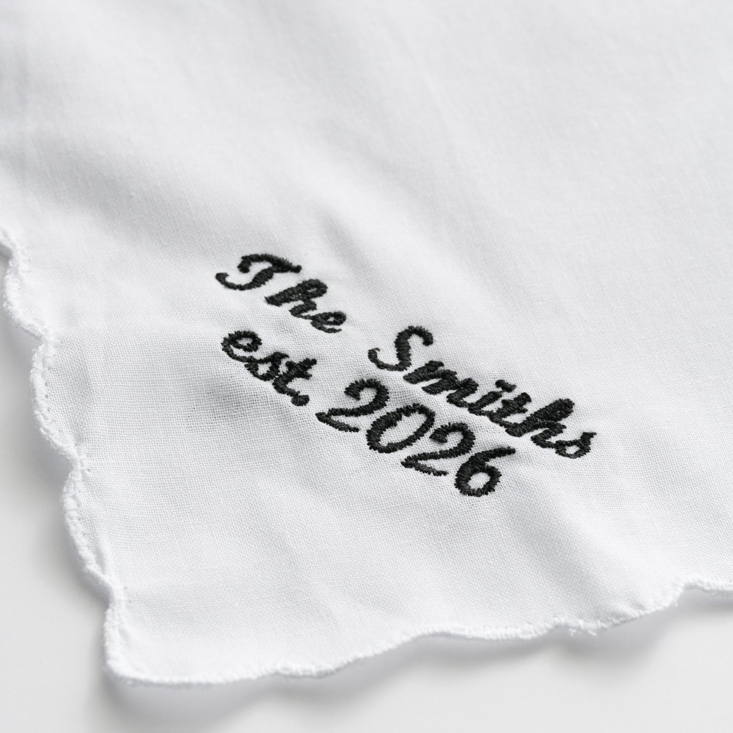 EMBROIDERED SURNAME WHITE SCALLOP NAPKIN